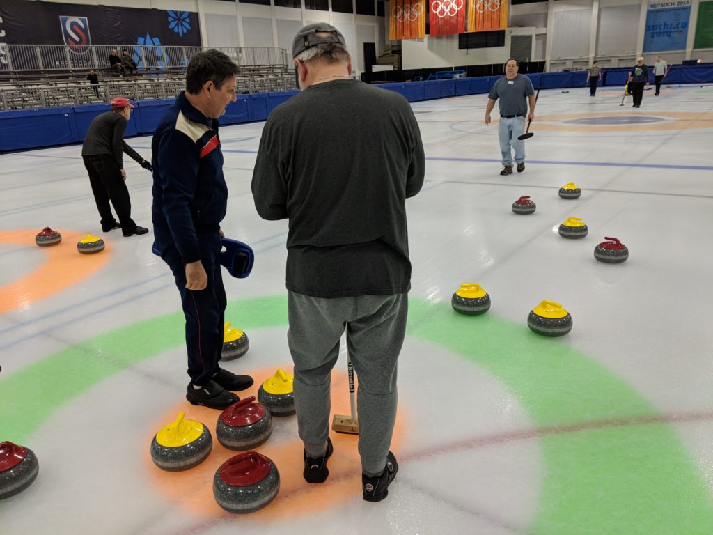 In the last shot of the final end of the winter 2018 Monday league, the yellow team faced a difficult shot to try to get their stone closest to the button on March 26, 2018, at the Utah Olympic Oval in Kearns.